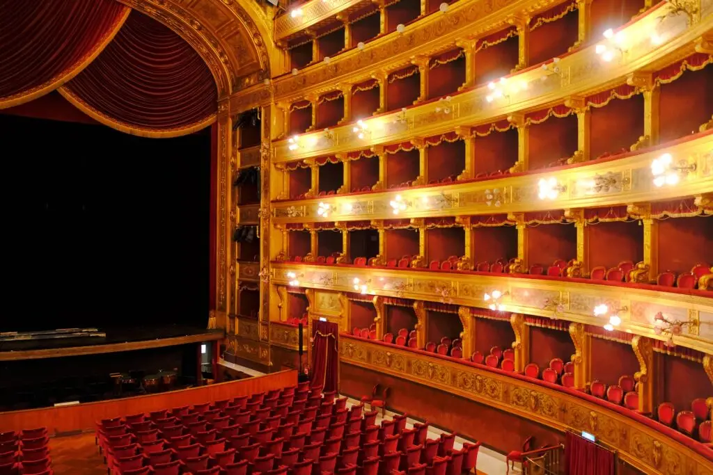 Ornate golden balconies and red velvet seats inside Teatro Massimo’s opera house