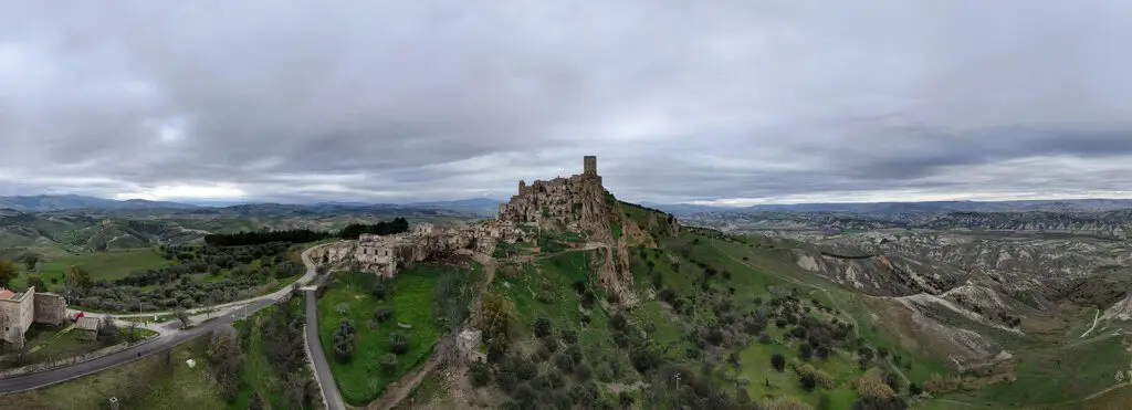 Aerial panorama of Craco ghost town overlooking the Basilicata countryside