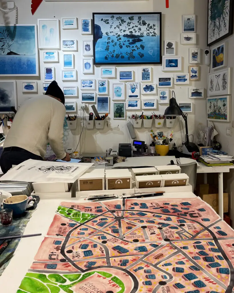 Artist working inside Idee Storte Paper in Palermo