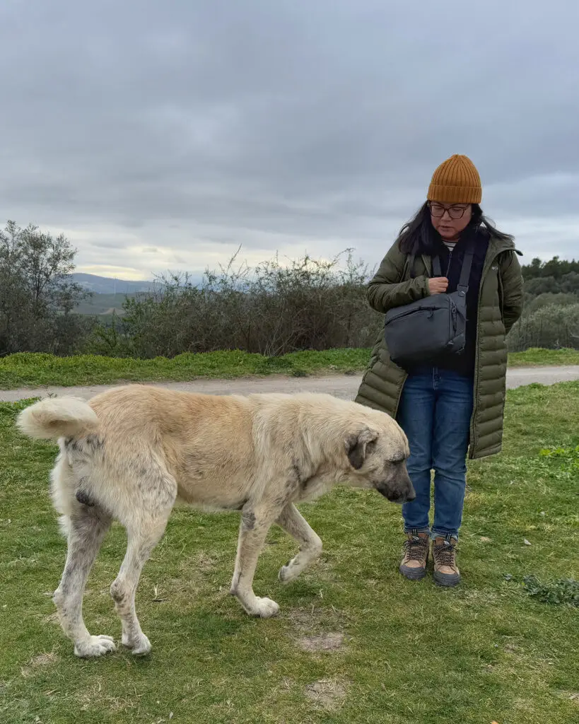 me standing beside a large dog near Craco ghost town